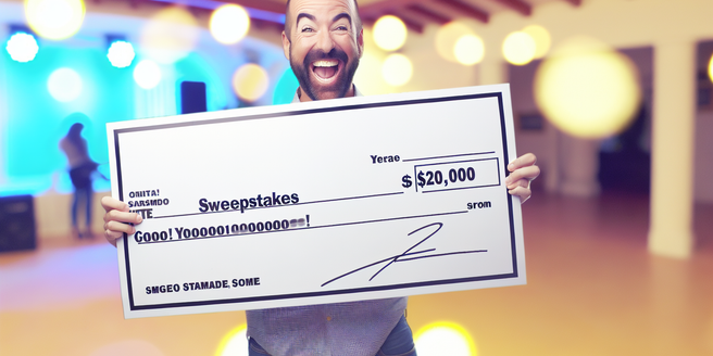 An excited person holding a large sweepstakes check