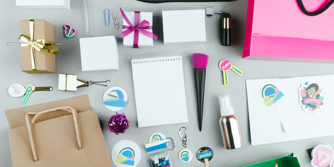 A creative flatlay of various promotional gifts arranged on a table